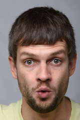 Image showing Close-up portrait of a very startled man of European appearance