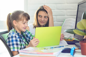 Image showing Mom is shocked by how her daughter is well versed in modern Internet technologies