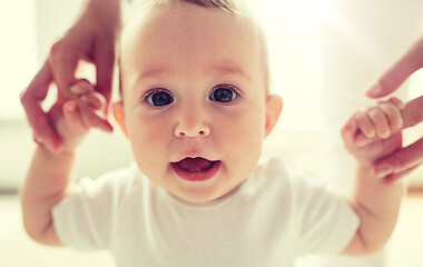 Image showing happy baby learning to walk with mother help