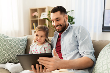 Image showing father and daughter with tablet computer at home