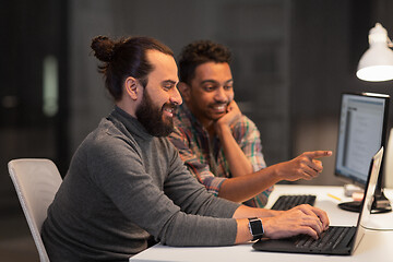 Image showing creative team with computer working late at office