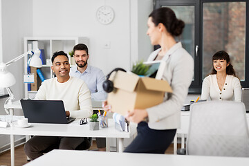 Image showing new female office worker with personal stuff