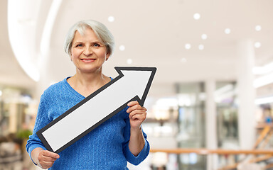 Image showing smiling senior woman with big rightwards arrow