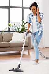 Image showing woman or housewife with vacuum cleaner at home