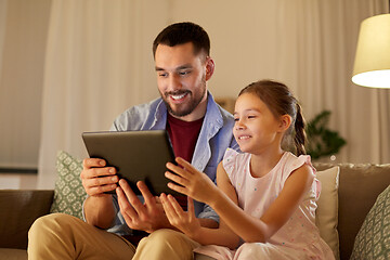 Image showing father and daughter with tablet computer at home