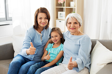 Image showing mother, daughter and grandmother showing thumbs up