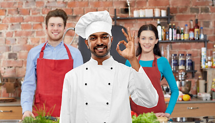 Image showing happy male indian chef showing ok at cooking class