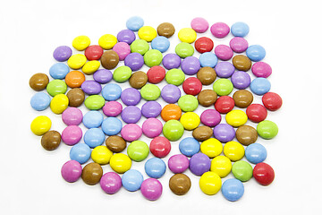Image showing Bright multicolored glazed chocolate candies on white