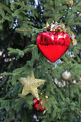 Image showing Beautiful decoration with heart toy on the branches of the Chris