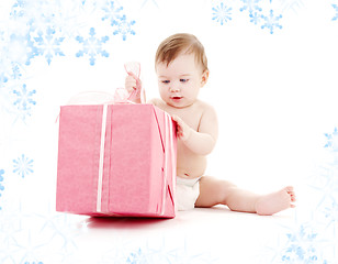 Image showing baby boy in diaper with big gift box