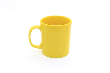 Image showing Bright yellow ceramic cup on white background