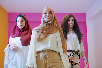 Image showing muslim women in fashionable dress isolated on pink