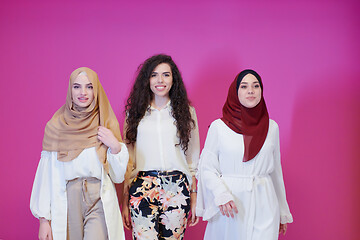 Image showing muslim women in fashionable dress isolated on pink