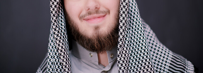 Image showing portrait of arabian man in front of black chalkboard