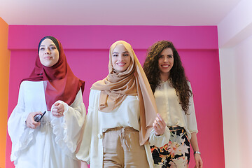 Image showing muslim women in fashionable dress isolated on pink