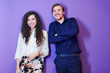 Image showing portrait of young couple isolated over purple background