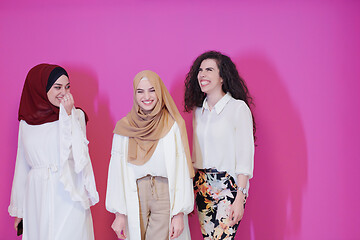 Image showing muslim women in fashionable dress isolated on pink