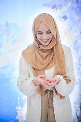 Image showing beautiful muslim woman making traditional prayer to God