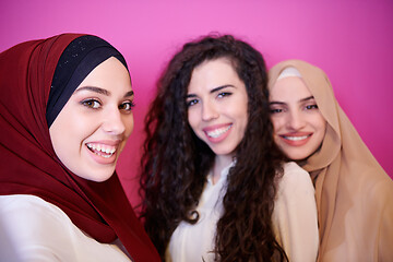 Image showing muslim women in fashionable dress isolated on pink