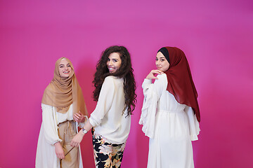 Image showing muslim women in fashionable dress isolated on pink