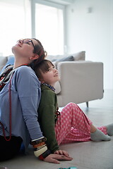 Image showing Mother and little girl daughter playing with jewelry  at home