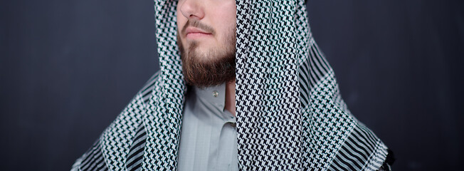 Image showing portrait of arabian man in front of black chalkboard