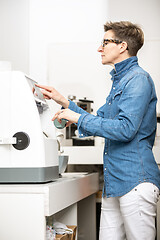 Image showing woman hone the edge of the eyeglasses