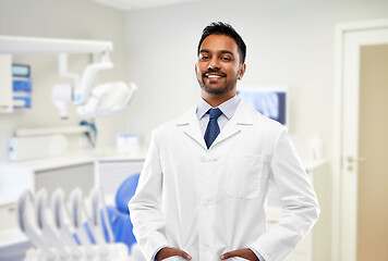 Image showing indian male dentist in white coat at dental clinic