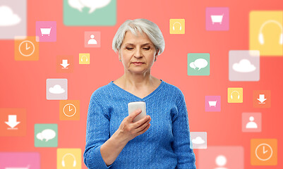 Image showing senior woman with smartphone over mobile app icons