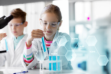 Image showing kids with test tubes studying chemistry at school