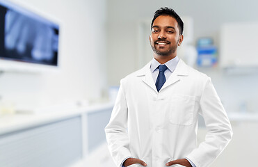 Image showing indian male dentist in white coat at dental clinic