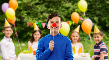 Image showing happy boy with red clown nose at birthday party