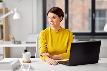 Image showing businesswoman with laptop computer at office