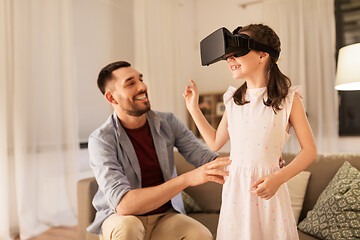 Image showing father and daughter in vr glasses playing at home