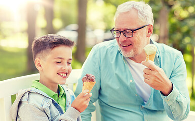 Image showing old man and boy eating ice cream at summer park