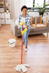 Image showing african woman or housewife cleaning floor at home