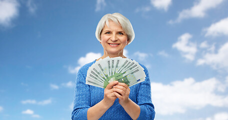 Image showing senior woman with hundreds of euro money banknotes