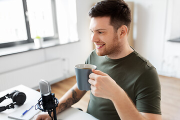 Image showing blogger with coffee and microphone audio blogging