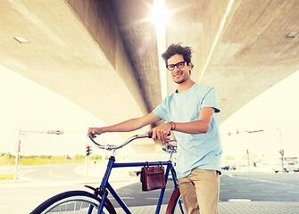 Image showing hipster man with fixed gear bike under bridge