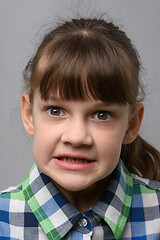 Image showing Portrait of an evil ten-year-old girl of European appearance, close-up