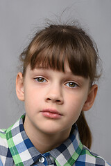 Image showing Portrait of a compassionate ten-year-old girl of European appearance, close-up