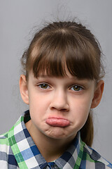 Image showing Portrait of a displeased ten-year-old girl of European appearance, close-up