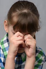 Image showing Portrait of a roaring ten-year-old girl of European appearance, close-up