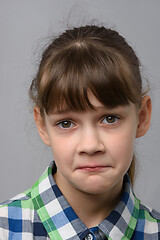 Image showing Portrait of a ten-year-old girl with a pitying look, European appearance, close-up