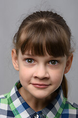 Image showing Portrait of a fun surprised ten year old girl of European appearance, close-up