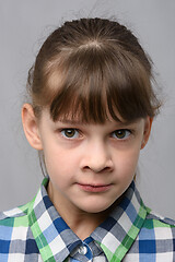 Image showing Portrait of a nervous ten-year-old girl of European appearance, close-up