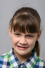 Image showing Portrait of a ten-year-old girl who is disgusted from what she saw, European appearance, closeup