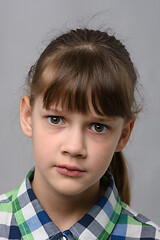 Image showing Portrait of a perplexed ten-year-old girl of European appearance, close-up