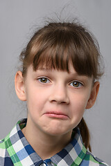 Image showing Portrait of a surprised ten year old girl, European appearance, close-up