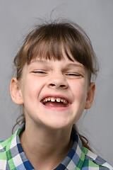 Image showing Portrait of a joyfully smiling ten-year-old girl of European appearance, close-up